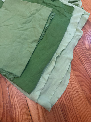 6.5 yards of assorted green raw silks